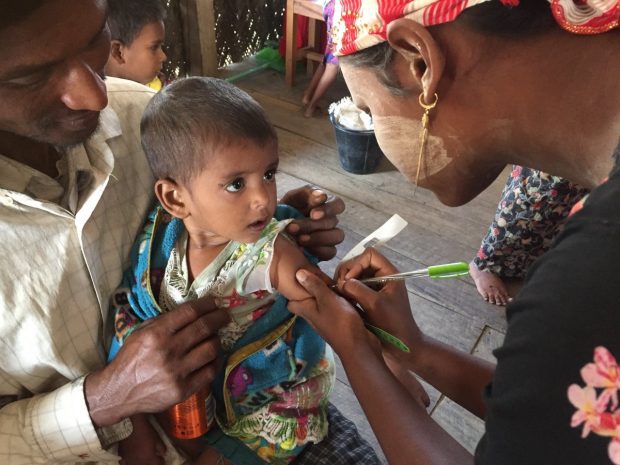 Young child being immunised