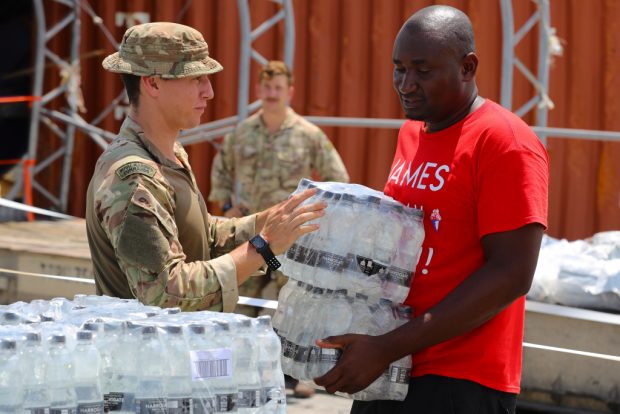 A British military Humanitarian and Disaster Relief (HADR) team from RFA Mounts Bay delivering food, water and emergency shelter kits on the island of Great Abaco in the Bahamas, as part of the UK's response to Hurricane Dorian.